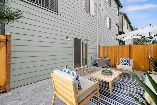 view of patio with central air condition unit and an outdoor living space