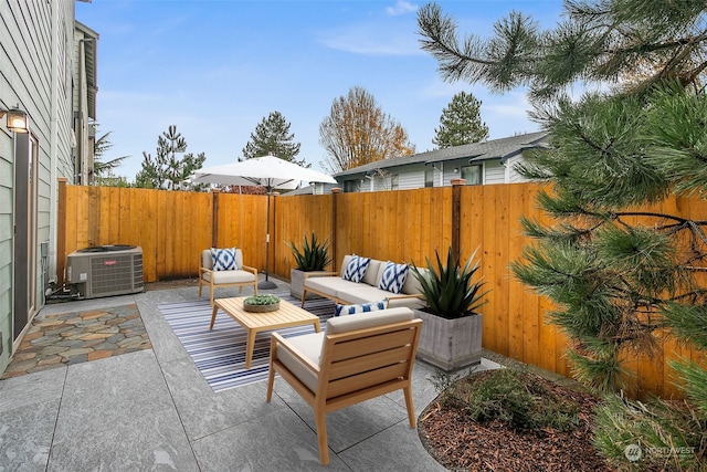 view of patio with outdoor lounge area and central AC unit