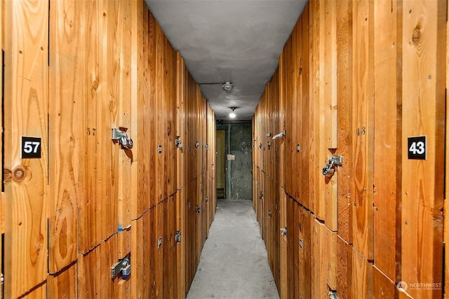 1000 Union St Unit 205, Seattle, WA 98101 - hallway featuring wooden walls and concrete floors