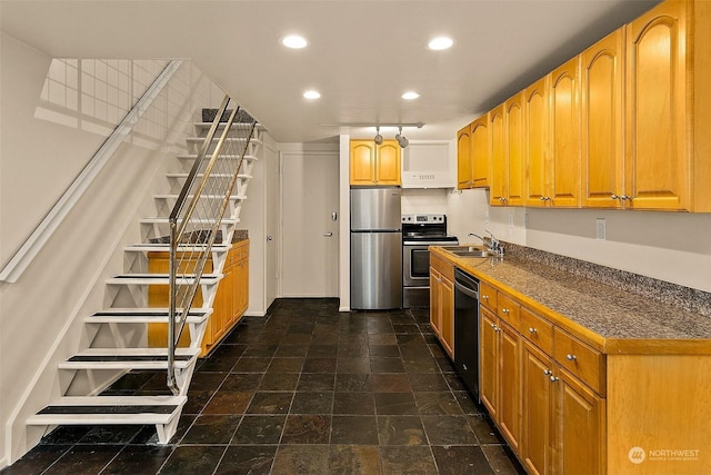 1000 Union St Unit 205, Seattle, WA 98101 - kitchen featuring appliances with stainless steel finishes, recessed lighting, extractor fan, brown cabinets, and dark stone finish floors