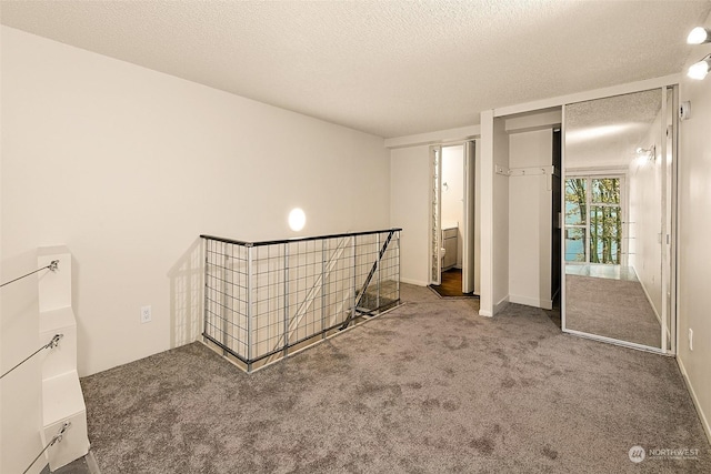 1000 Union St Unit 205, Seattle, WA 98101 - unfurnished bedroom featuring carpet flooring, a textured ceiling, and a closet