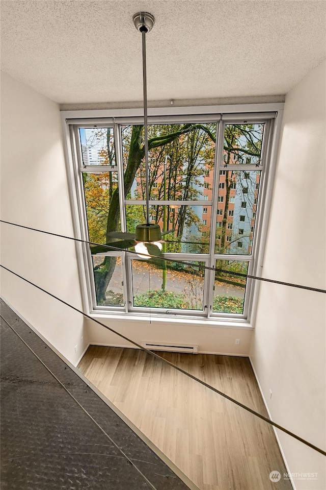 1000 Union St Unit 205, Seattle, WA 98101 - detailed view of a textured ceiling and wood finished floors