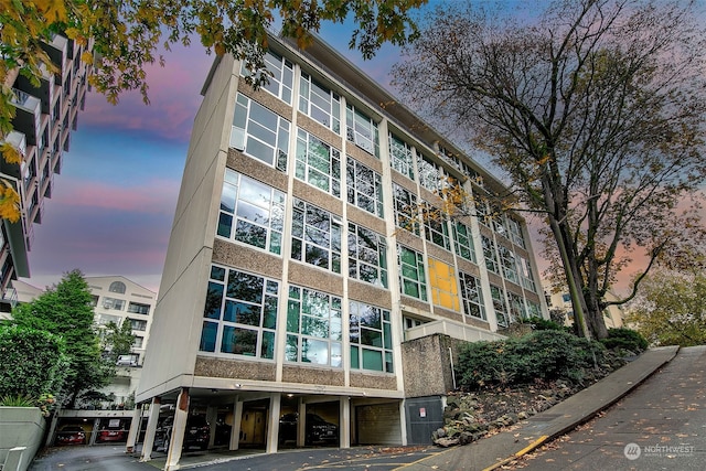 view of outdoor building at dusk