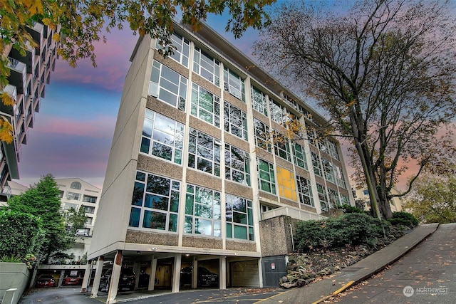 1000 Union St Unit 205, Seattle, WA 98101 - property at dusk with a carport