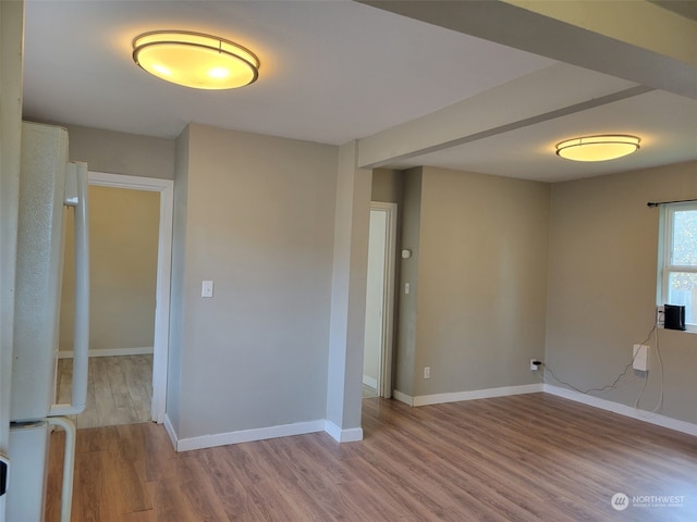 spare room with light hardwood / wood-style floors