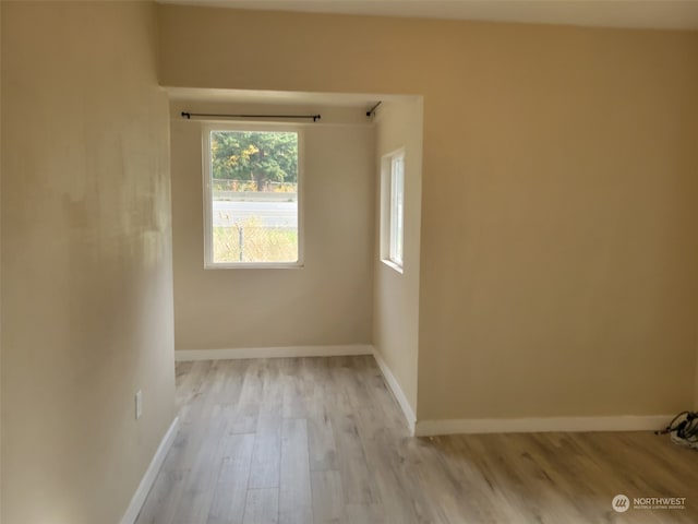 spare room featuring light wood-type flooring