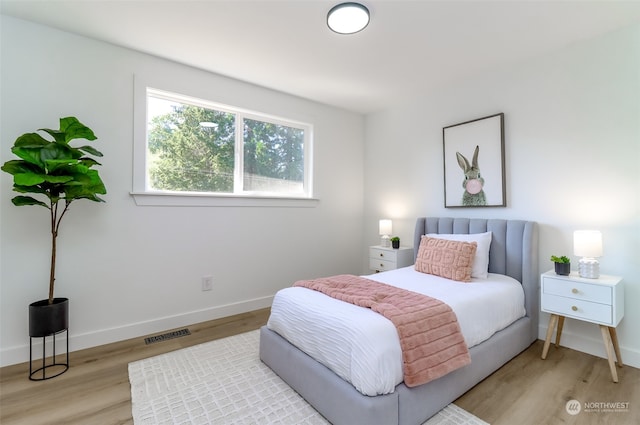 bedroom with light hardwood / wood-style floors