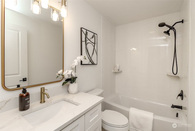 full bathroom featuring vanity, toilet, and tiled shower / bath