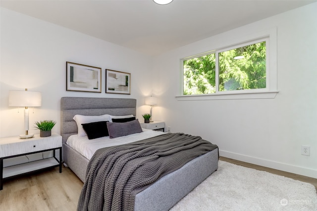 bedroom featuring light wood-type flooring