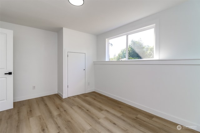 spare room featuring light hardwood / wood-style flooring