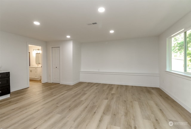 spare room with light hardwood / wood-style flooring