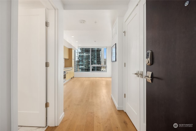 hallway with light wood-type flooring