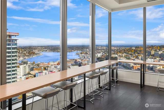 unfurnished sunroom with a water view