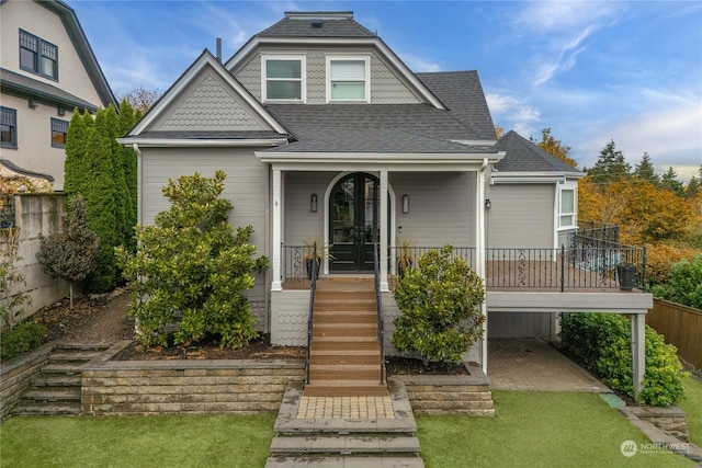 view of front of home featuring a porch and a front yard