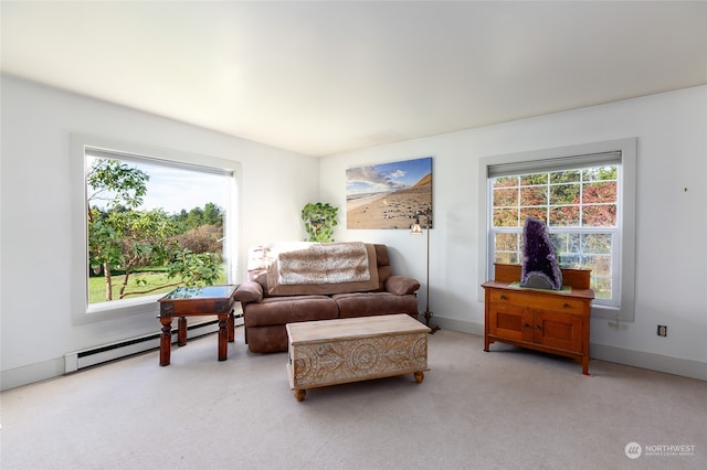 living room featuring baseboard heating and light carpet