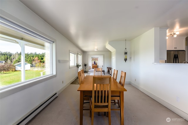 dining space with baseboard heating