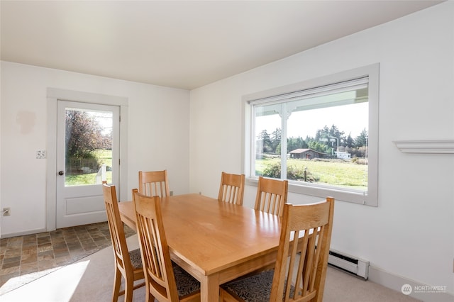 dining area featuring a baseboard heating unit