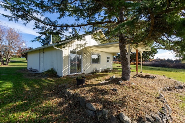 view of home's exterior featuring a yard