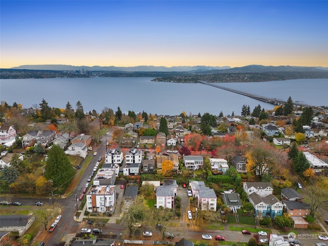 aerial view at dusk with a water view