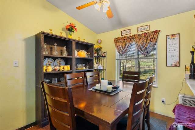 dining space featuring ceiling fan, dark hardwood / wood-style floors, and lofted ceiling