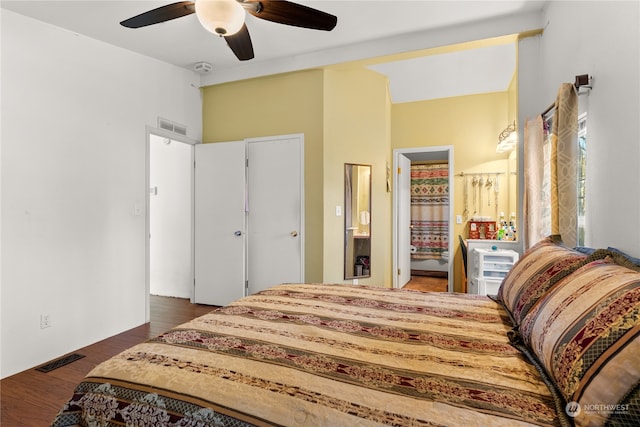 bedroom with ceiling fan and dark hardwood / wood-style flooring