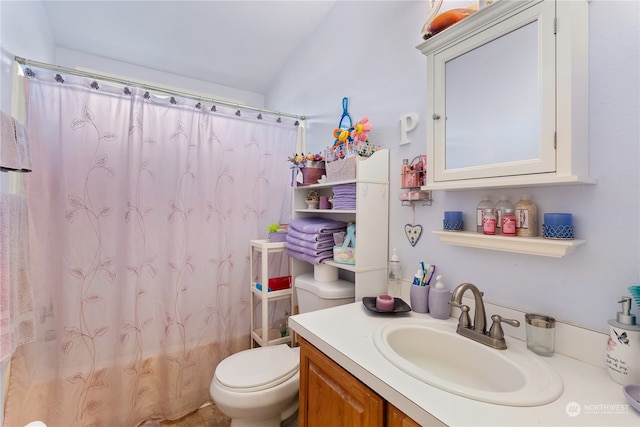 full bathroom featuring shower / tub combo, vanity, vaulted ceiling, and toilet