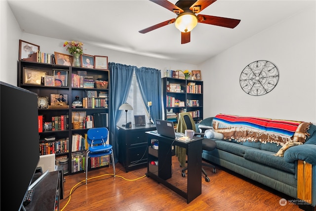 home office featuring hardwood / wood-style floors and ceiling fan