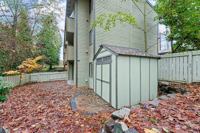 view of home's exterior with a storage shed