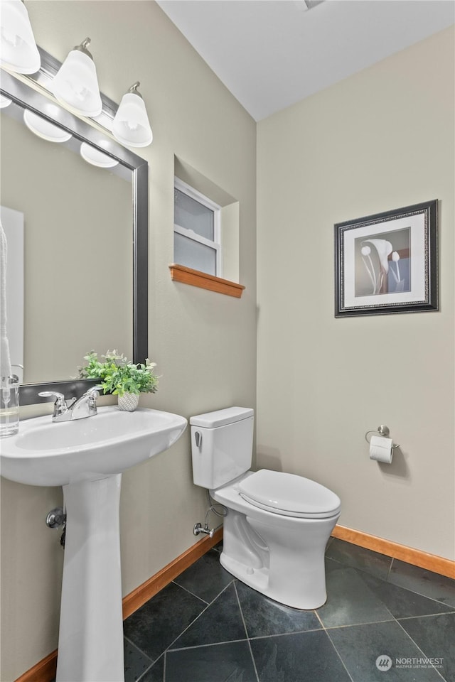 bathroom with tile patterned floors and toilet