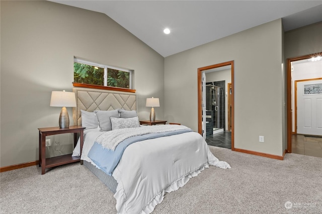 carpeted bedroom featuring a walk in closet and vaulted ceiling