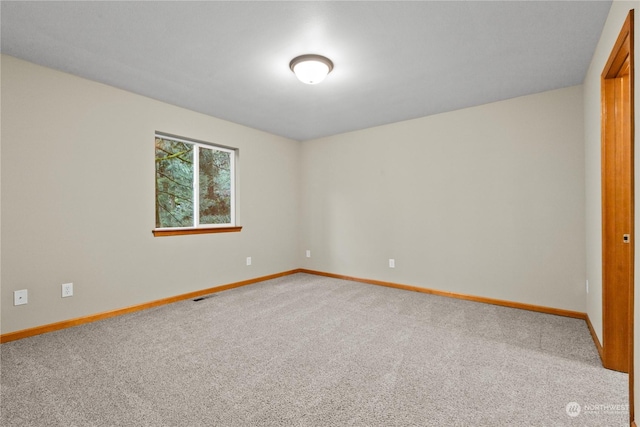 empty room featuring carpet flooring