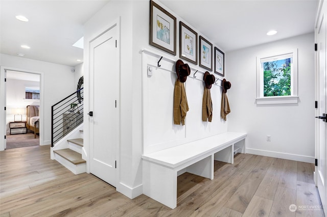 mudroom with light hardwood / wood-style flooring