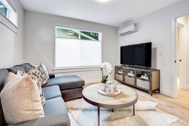 living room featuring hardwood / wood-style flooring and a wall mounted AC