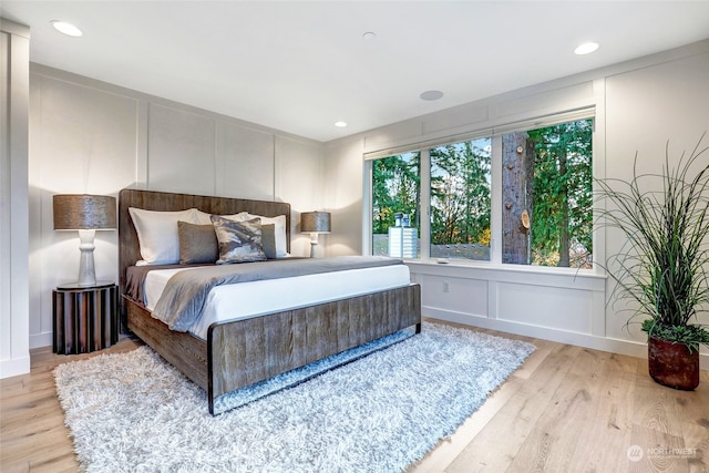 bedroom with light hardwood / wood-style floors