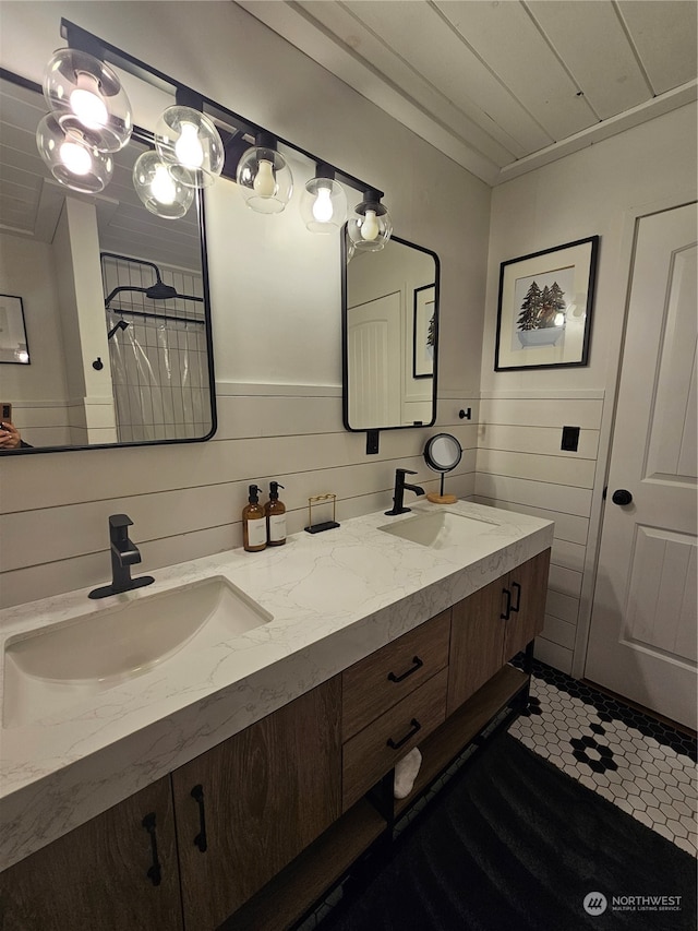 bathroom with tile patterned floors and vanity