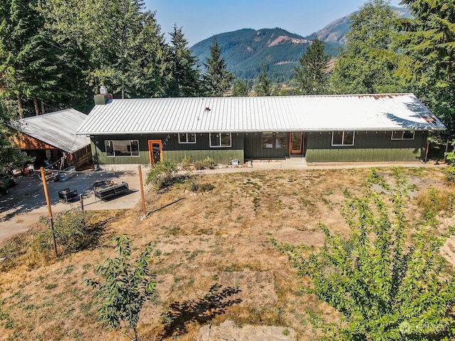 exterior space with a mountain view and a porch