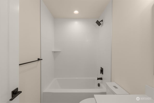 full bath featuring washtub / shower combination, toilet, and recessed lighting