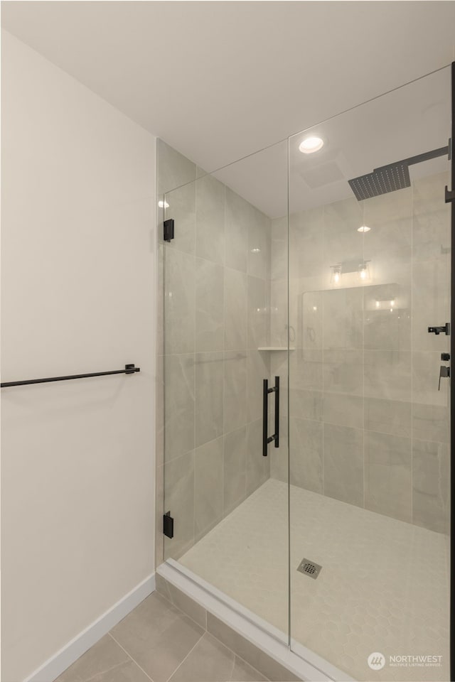 full bathroom with baseboards, recessed lighting, a shower stall, and tile patterned floors