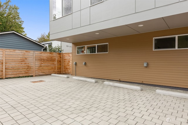 view of patio featuring fence