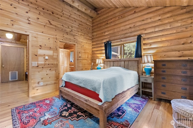 bedroom with wooden ceiling, high vaulted ceiling, and light wood-type flooring