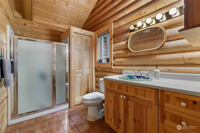 bathroom with tile patterned floors, lofted ceiling, vanity, toilet, and an enclosed shower