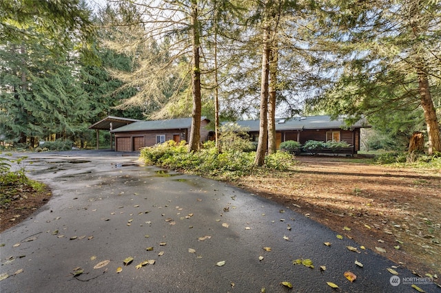 view of front of property featuring a carport