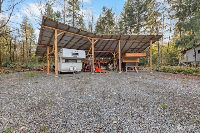 view of vehicle parking with a carport