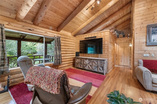 living room with wooden walls, light wood-type flooring, lofted ceiling with beams, and wooden ceiling