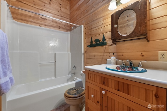 full bathroom featuring vanity, wooden walls, toilet, and shower / tub combination