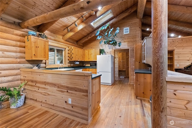 kitchen featuring white refrigerator, a skylight, light hardwood / wood-style flooring, and wooden ceiling