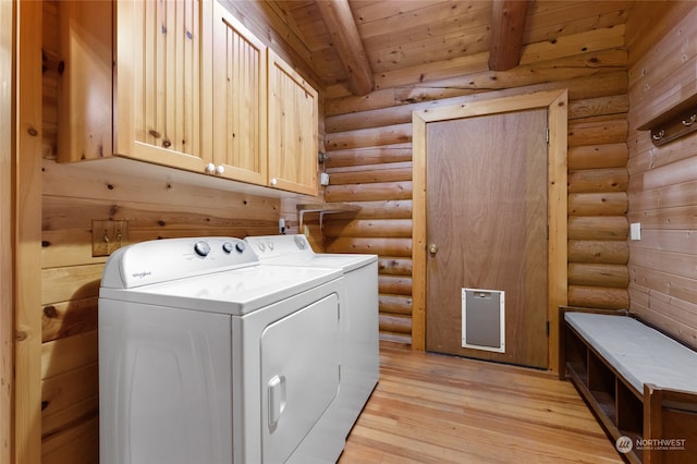 laundry area with cabinets, light wood-type flooring, log walls, separate washer and dryer, and wooden ceiling