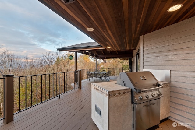 wooden deck featuring area for grilling