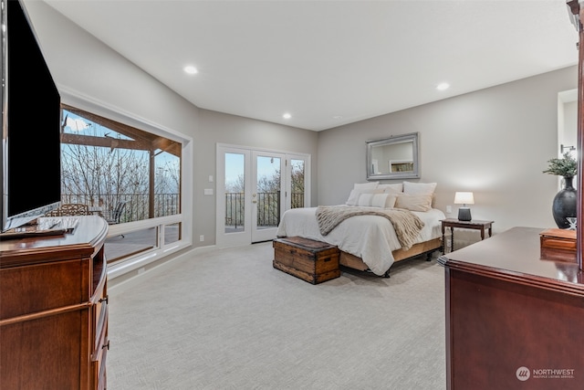 bedroom featuring access to outside and light colored carpet