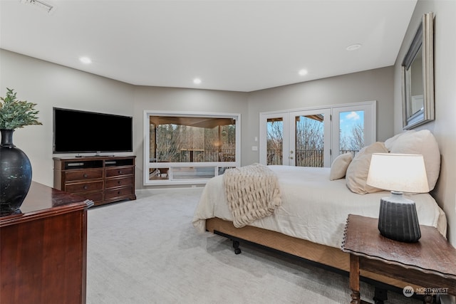 carpeted bedroom featuring access to exterior and french doors